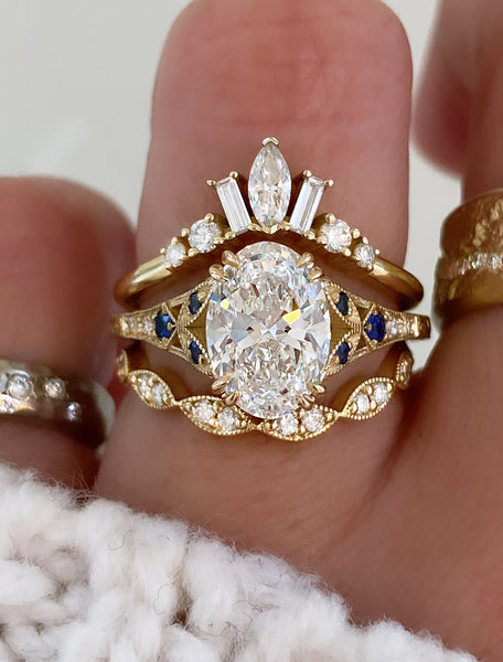 caption:stacked with Islet & Natali Curved wedding bands