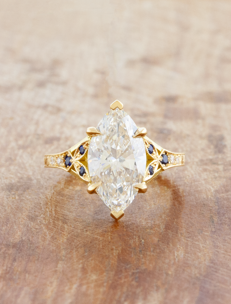 caption:Shown with 3ct marquise in 14k yellow gold