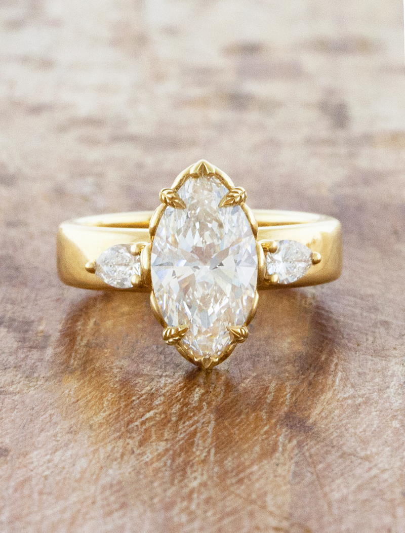 caption:Shown with 2.5ct marquise in 14k yellow gold