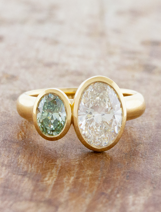 caption:Shown with 0.5ct fancy green & 1.5ct white oval diamonds in 18k yellow gold