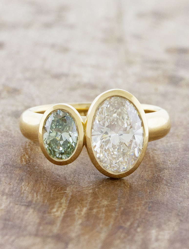 caption:Shown with 0.5ct fancy green & 1.5ct white oval diamonds in 18k yellow gold