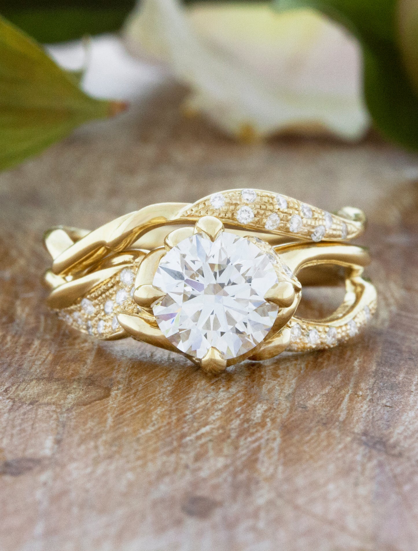 caption:Shown with 1.7ct round cut, stacked with London wedding band