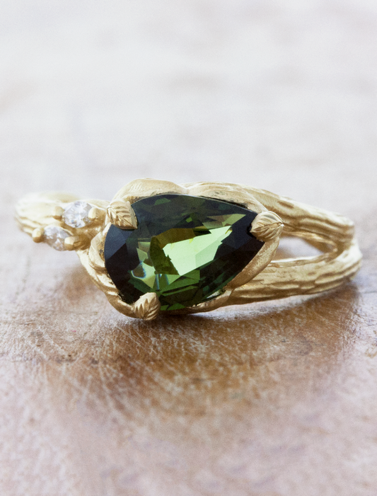 caption:Shown with 2.30ct pear green sapphire in 14k yellow gold