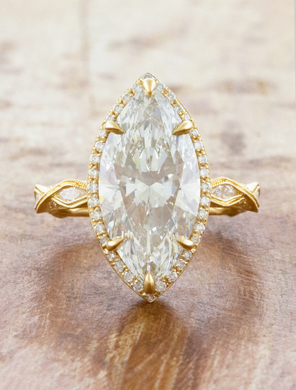 caption:Shown with 5ct marquise in 14k yellow gold