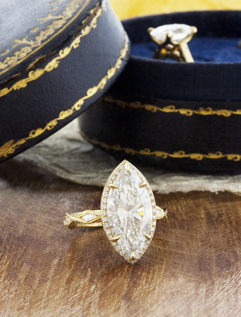 caption:Shown with 5ct marquise in 14k yellow gold