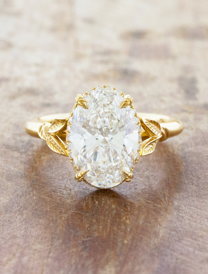 caption:Shown with 2.5ct oval in 18k yellow gold 