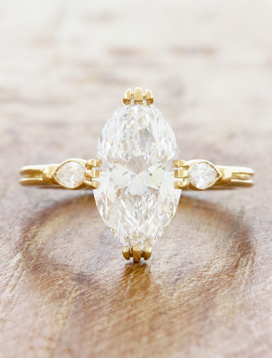 caption:Shown with 3ct marquise diamond in 14k yellow gold 