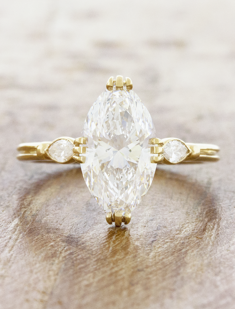 caption:Shown with 3ct marquise diamond in 14k yellow gold 