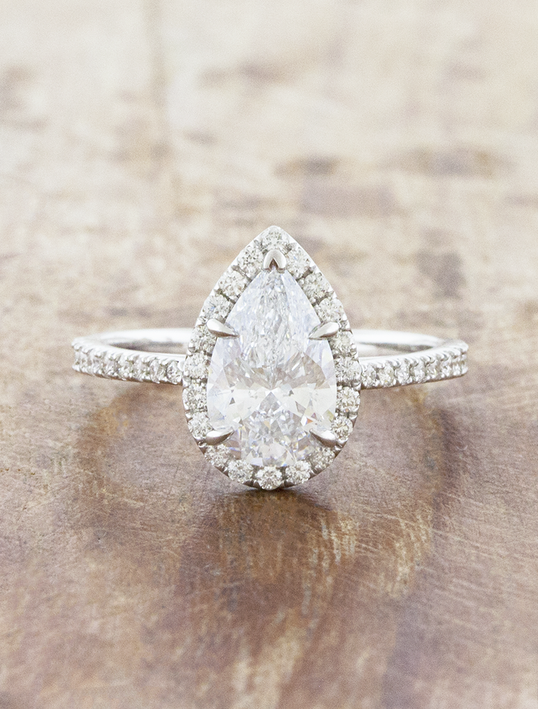 caption:Shown with 1.5ct pear in platinum