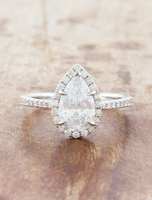 caption:Shown with 1.5ct pear in platinum