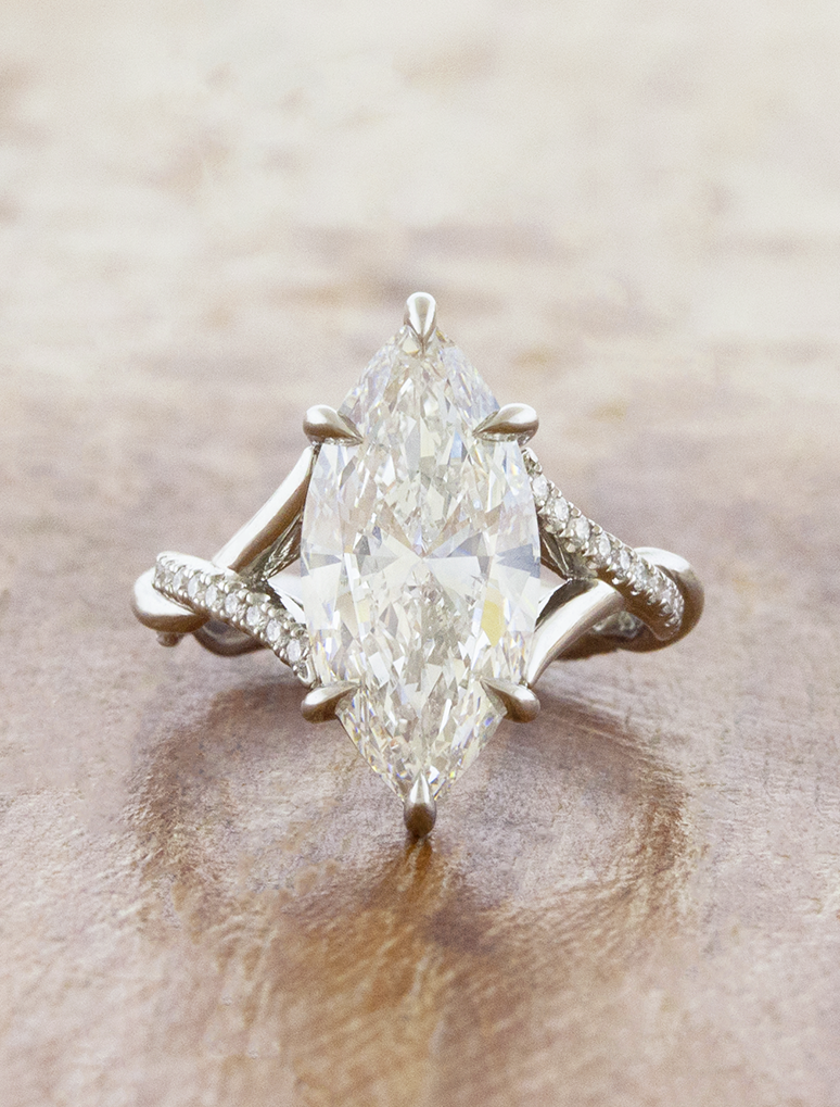 caption:Shown with 3ct marquise in platinum
