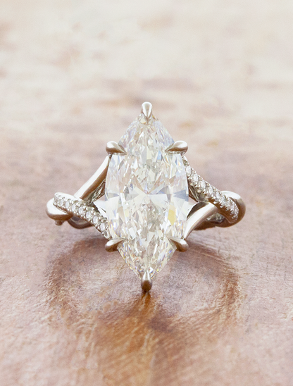 caption:Shown with 3ct marquise in platinum