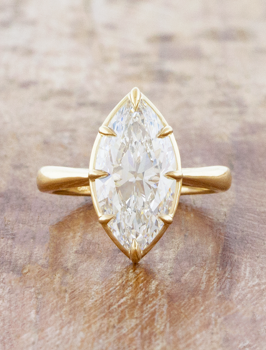 caption:Shown with 4ct marquise diamond in 14k yellow gold 