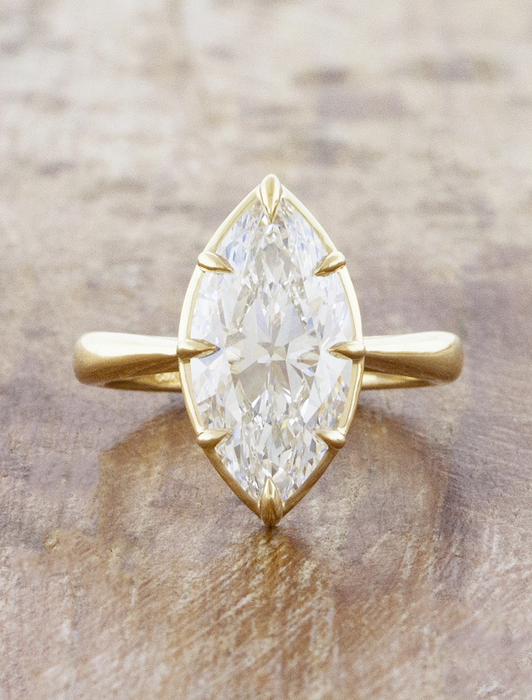 caption:Shown with 4ct marquise diamond in 14k yellow gold 