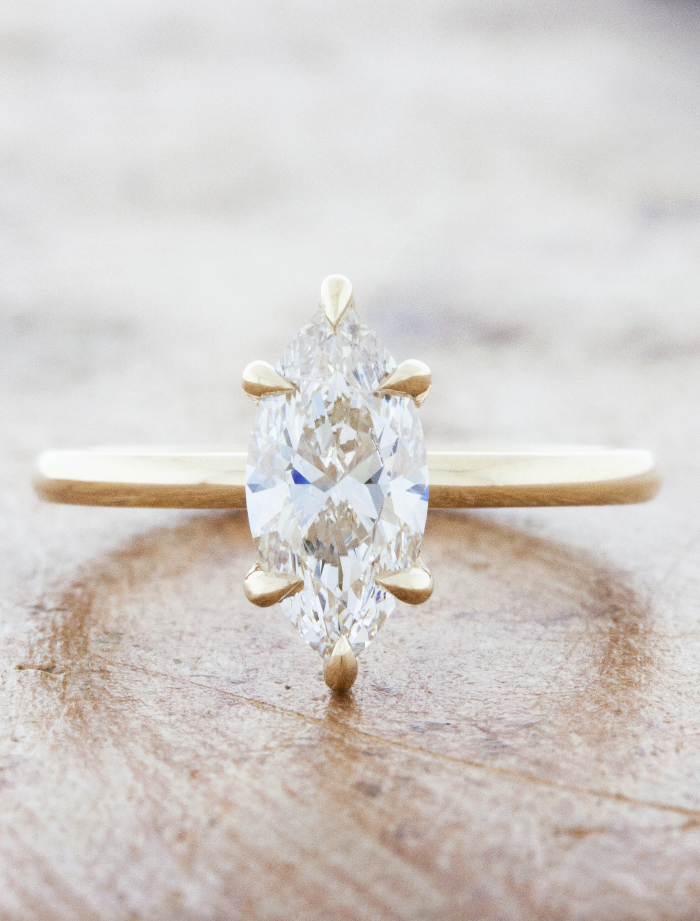 caption:Shown with 1.2ct marquise diamond in 14k yellow gold