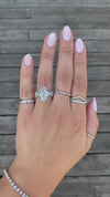 caption:Shown with 3ct marquise diamond in platinum