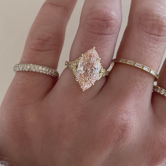 caption:Shown with 4ct fancy pink marquise in 14k yellow gold