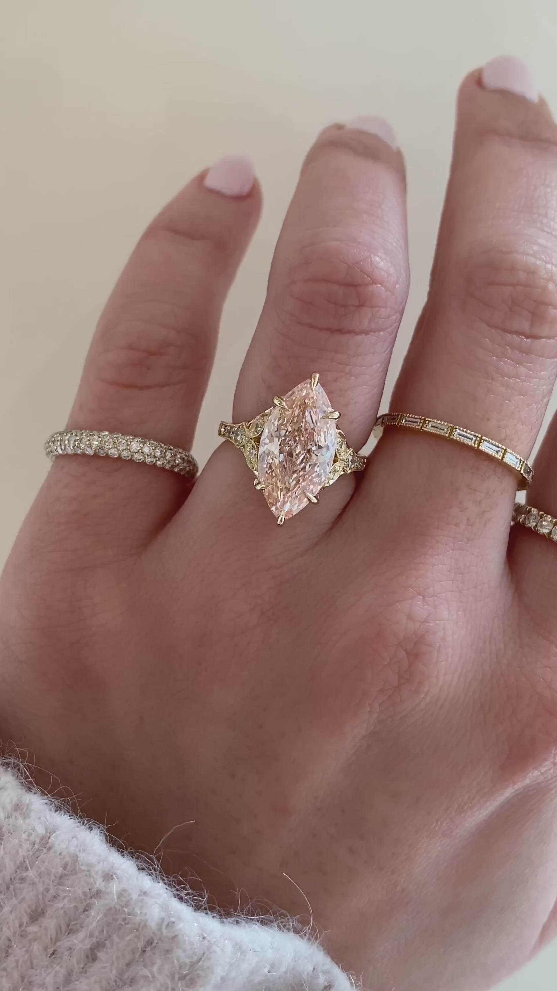 caption:Shown with 4ct fancy pink marquise in 14k yellow gold
