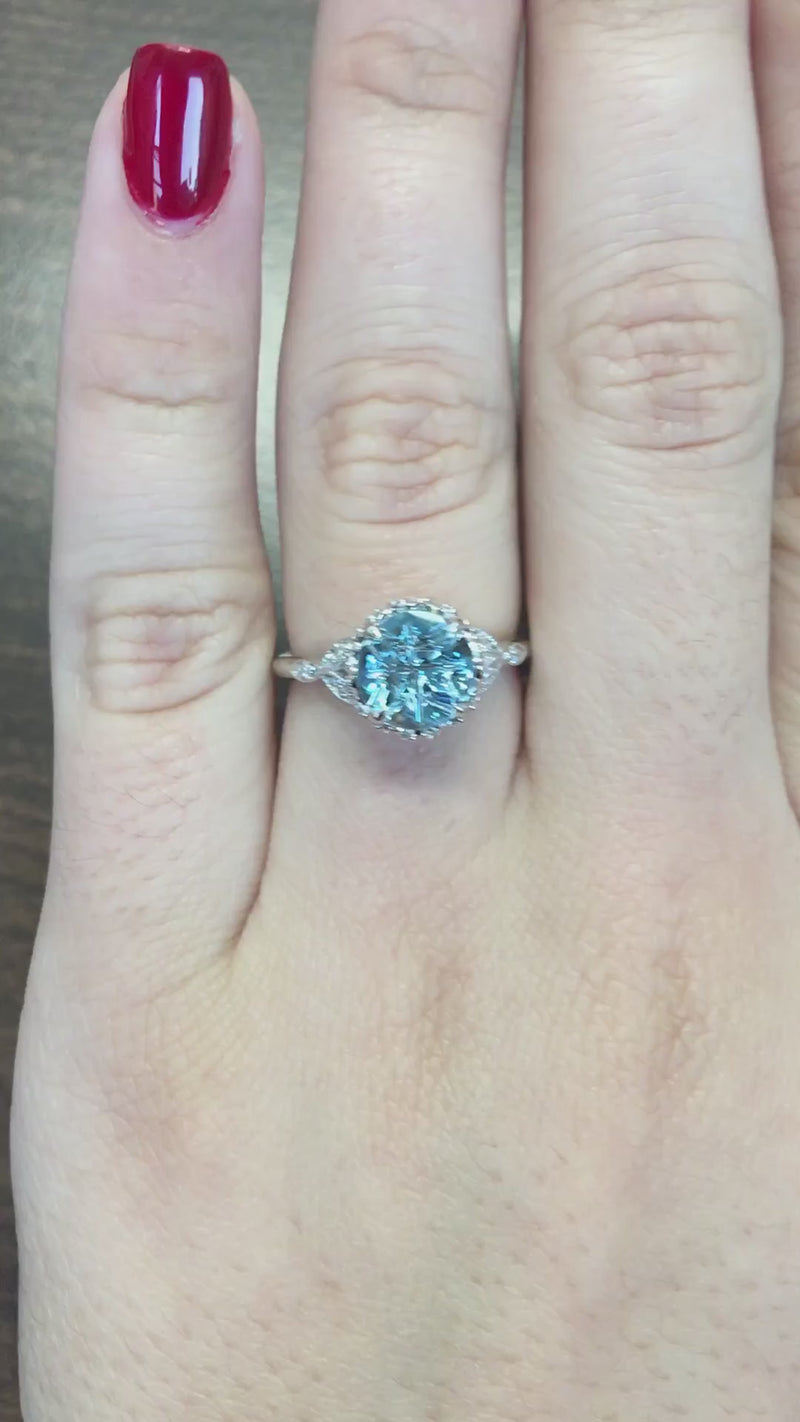 caption:Shown with 2.2ct medicine wheel cut aquamarine in platinum
