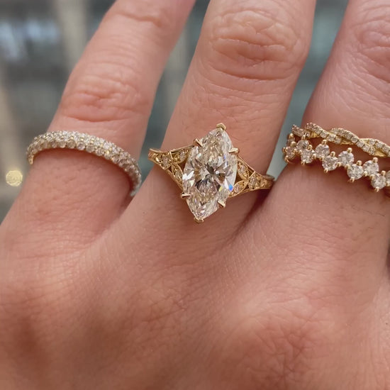 caption:Shown with 2ct marquise in 18k yellow gold