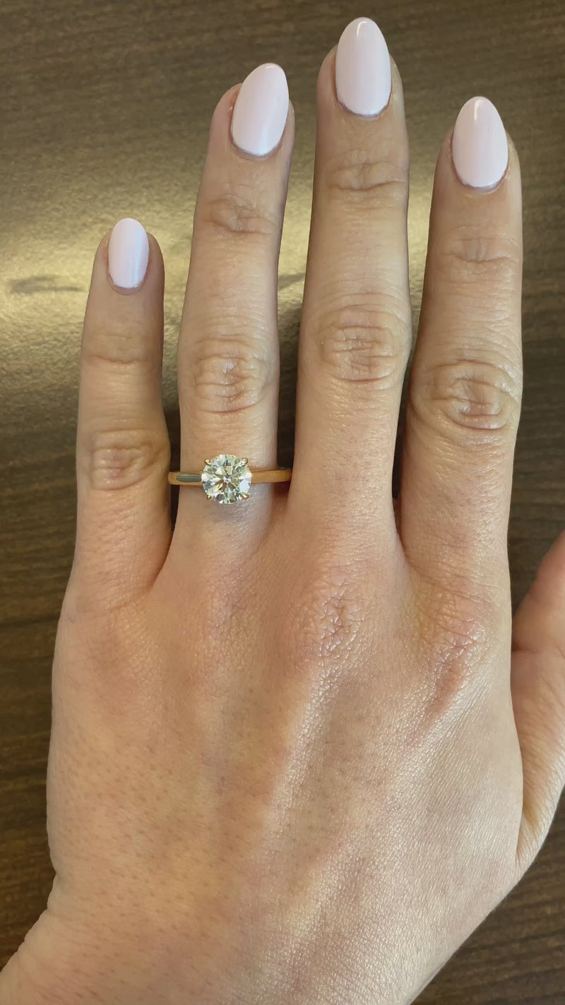 caption:Shown with 1.5ct round diamond in 14k yellow gold