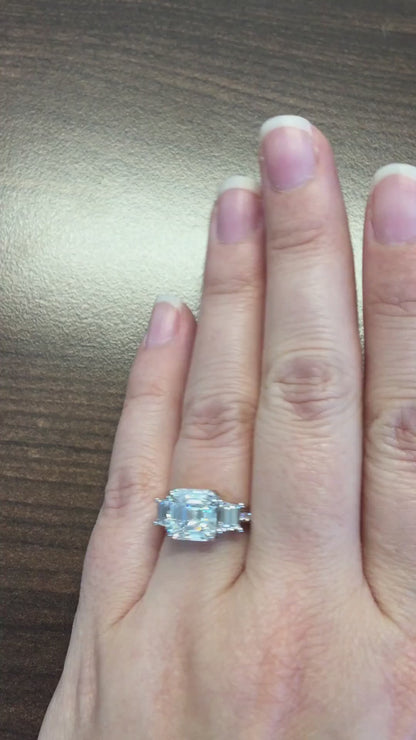 caption:Shown in platinum with 3ct asscher cut diamond center stone