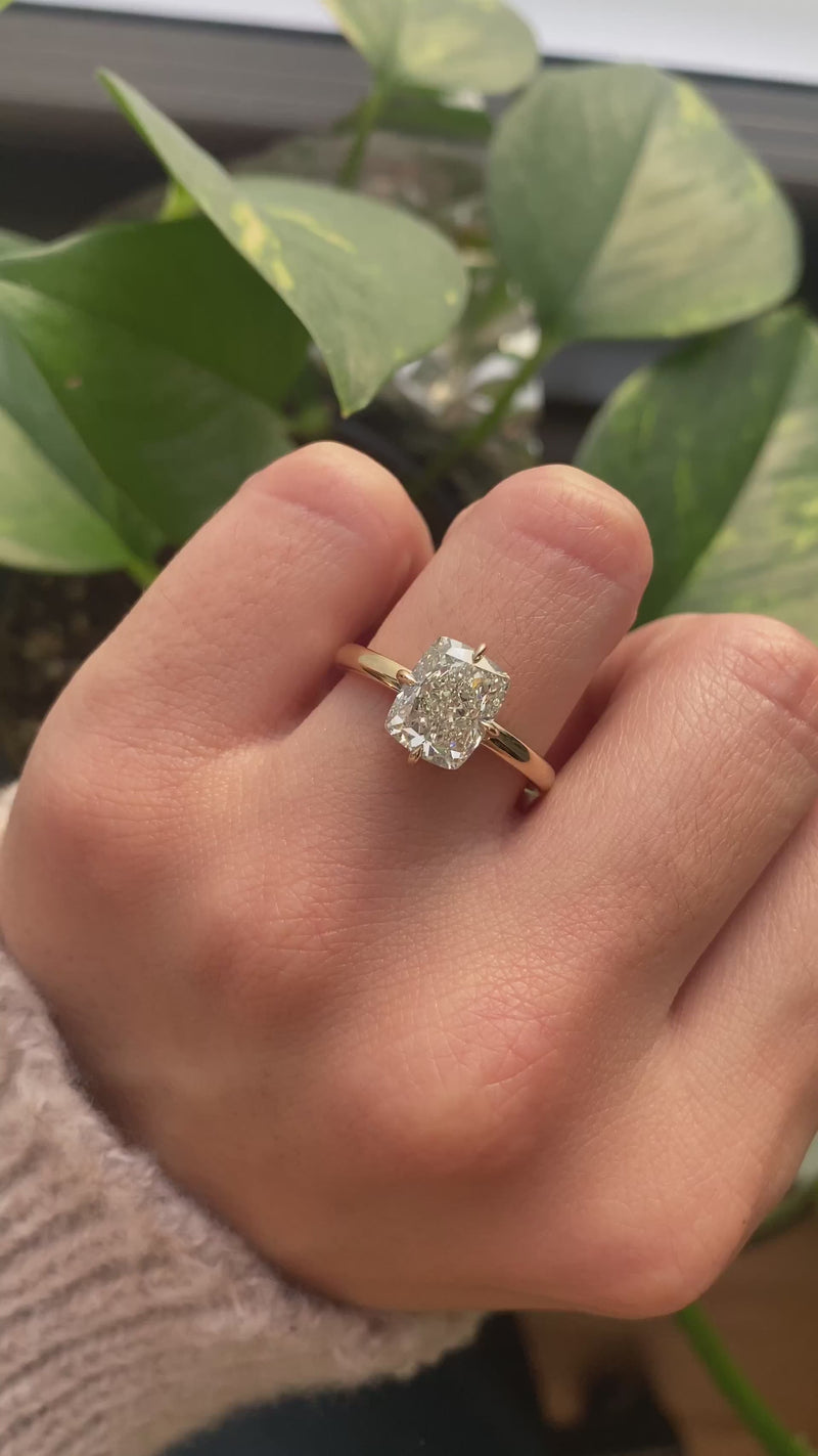 caption:Shown with 3ct cushion cut in 14k yellow gold 