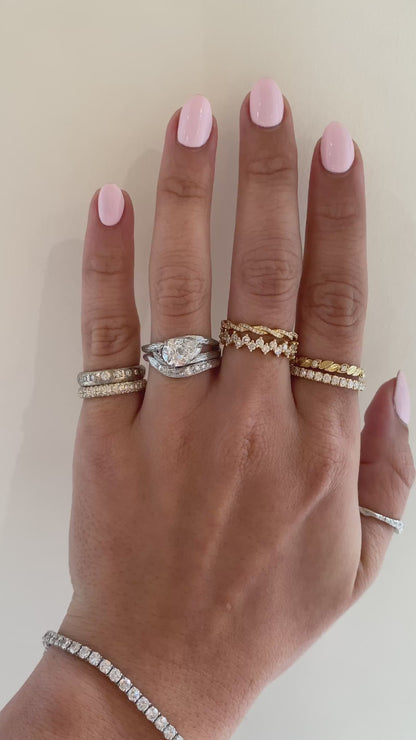 caption:Shown with 1.5ct pear diamond in white gold, stacked with Isle