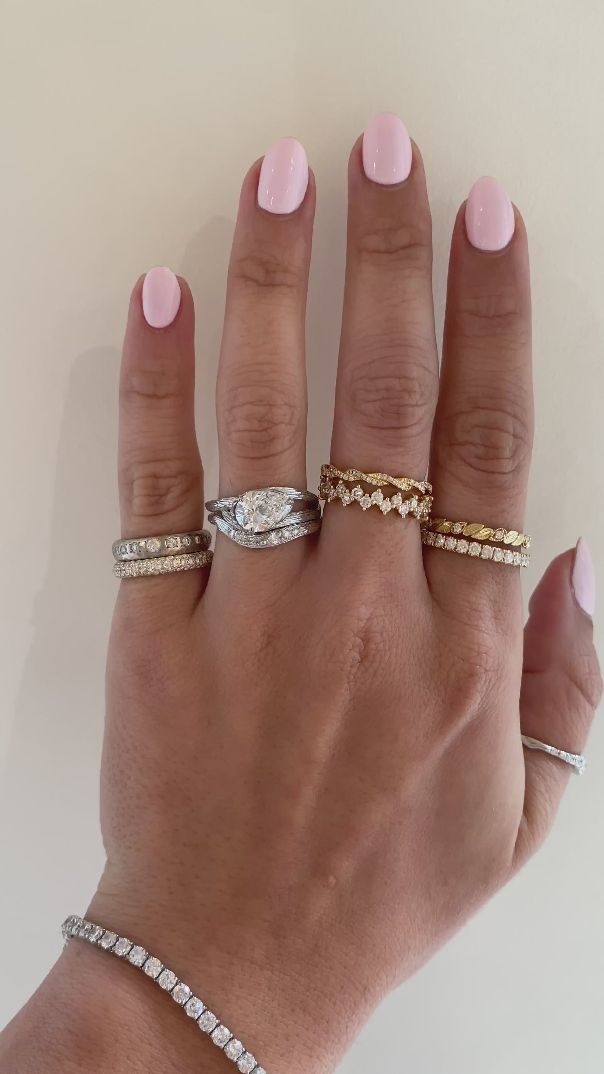 caption:Shown with 1.5ct pear diamond in white gold, stacked with Isle