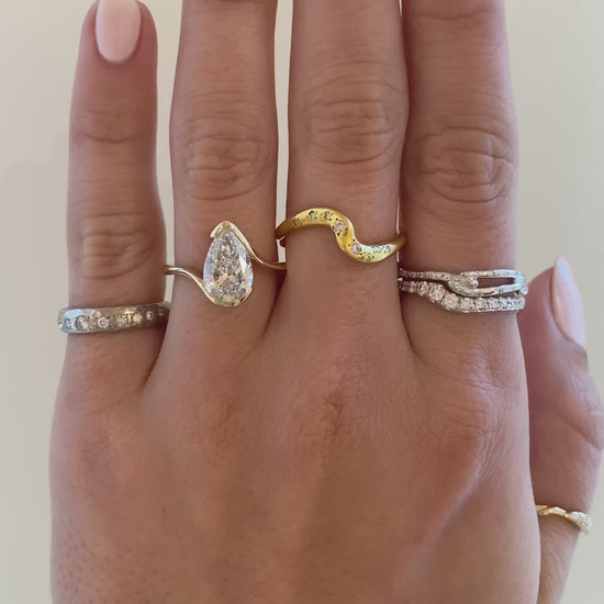 caption:Shown with 2.5ct pear in 14k yellow gold