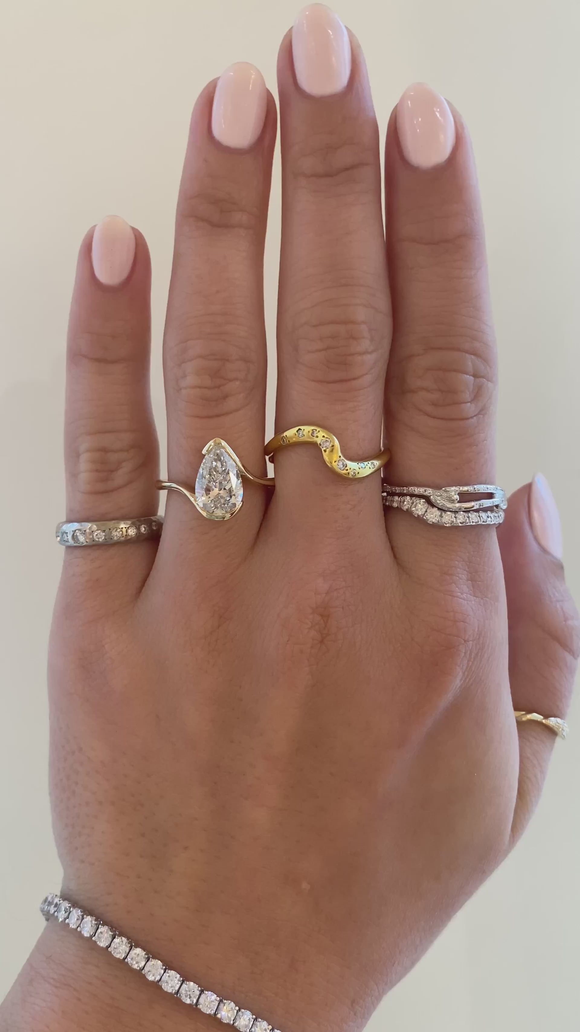 caption:Shown with 2.5ct pear in 14k yellow gold