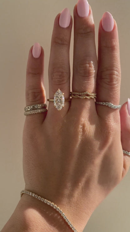 caption:Shown with 3ct marquise in 14k yellow gold 