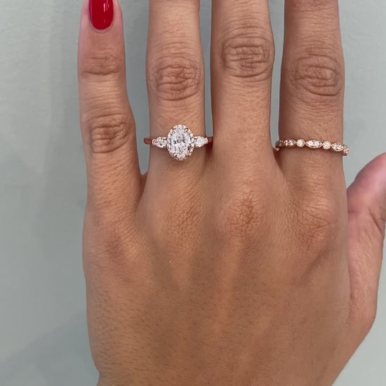 caption:Shown with 1ct oval cut diamond set in rose gold