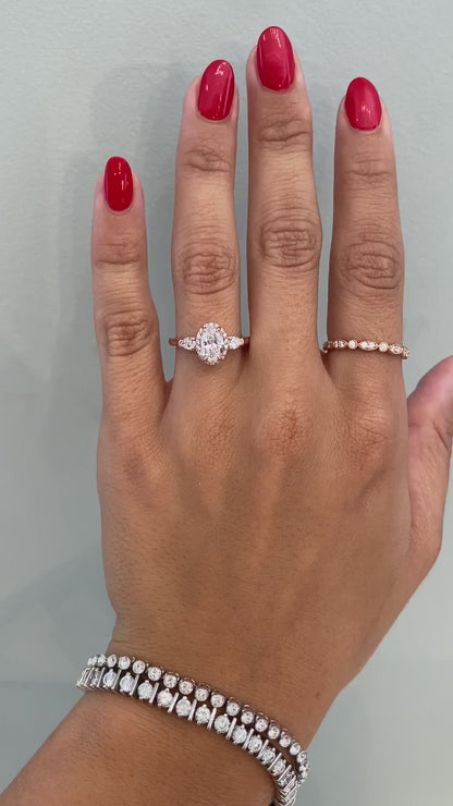 caption:Shown with 1ct oval cut diamond set in rose gold