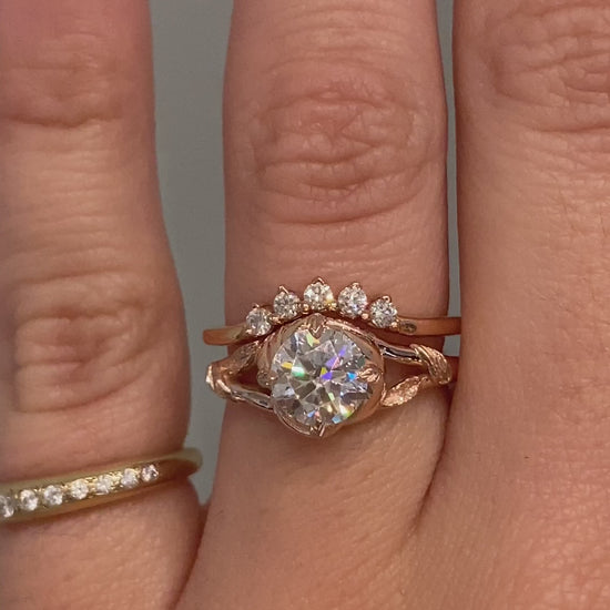 caption:Shown with 0.70ct round cut diamond paired with Antoinette wedding band