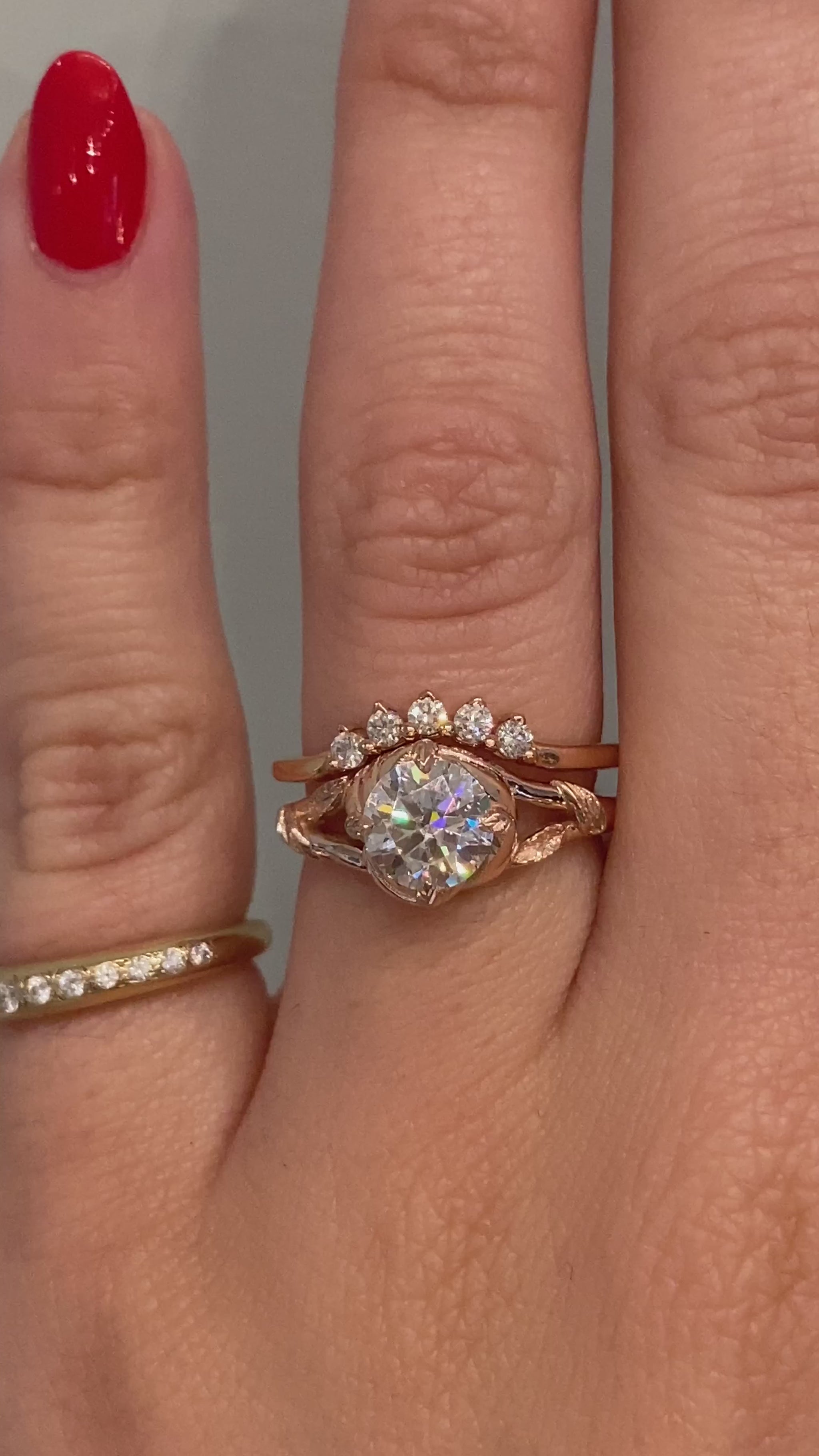 caption:Shown with 0.70ct round cut diamond paired with Antoinette wedding band