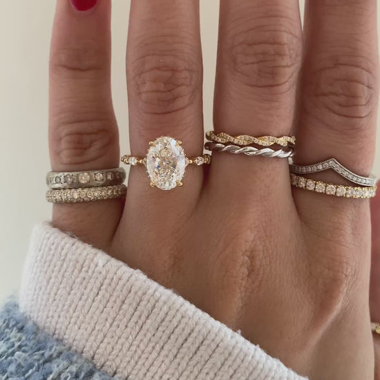 caption:Shown with 2.5ct oval diamond in 18k yellow gold