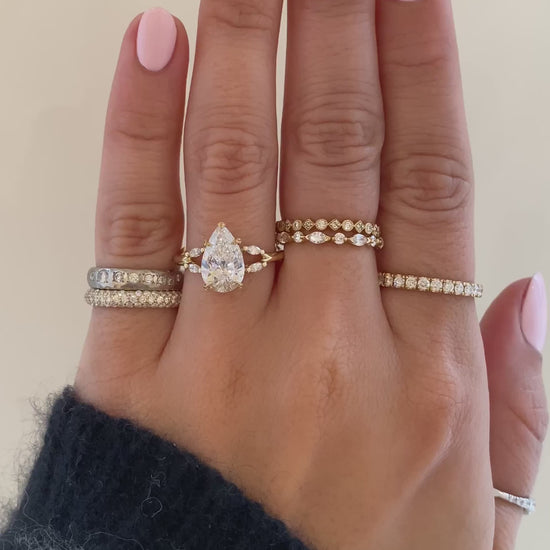 caption:Shown with 2ct pear in 14k yellow gold 