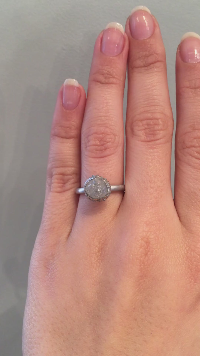caption:Shown with 3.15ct rough cut diamond in platinum