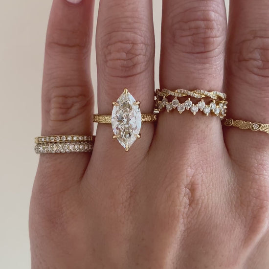 caption:Shown with 3ct marquise in 18k yellow gold, customized with surprise gemstone