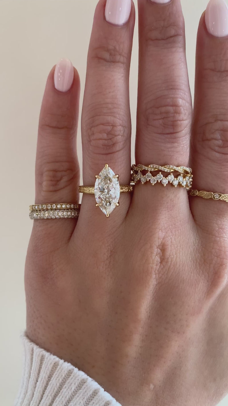 caption:Shown with 3ct marquise in 18k yellow gold, customized with surprise gemstone