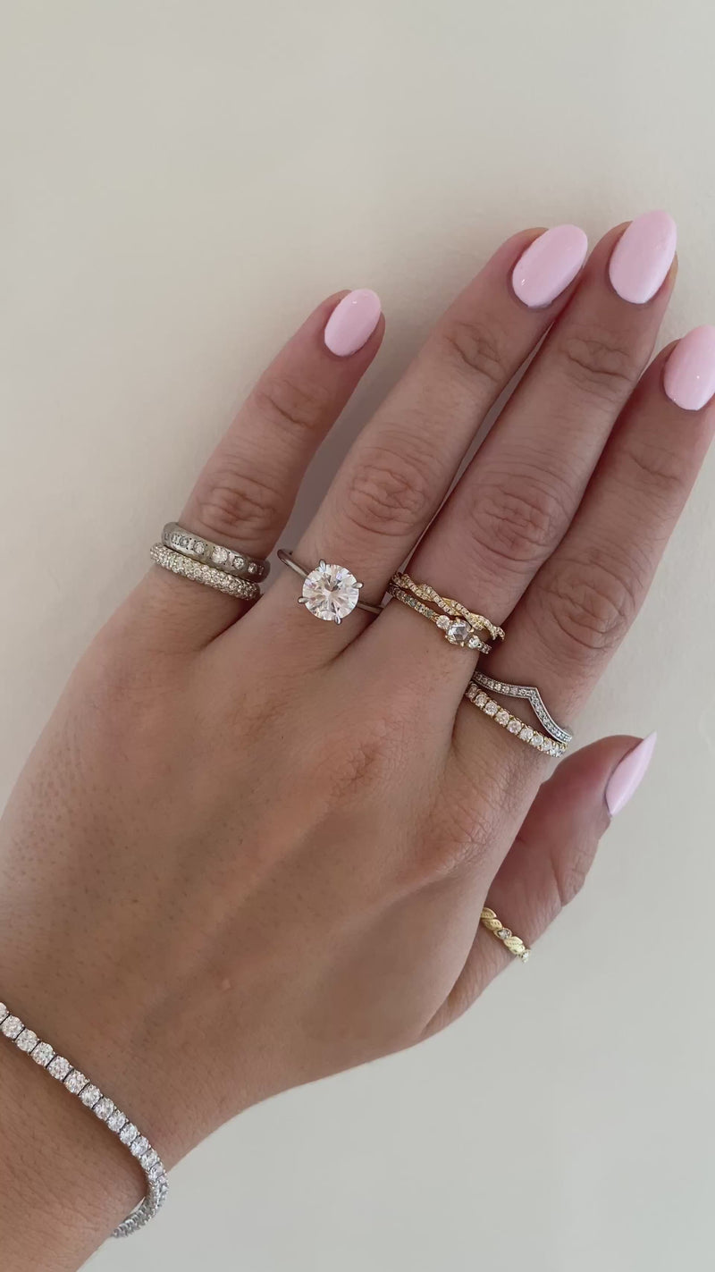caption: Shown with 2ct round diamond in platinum
