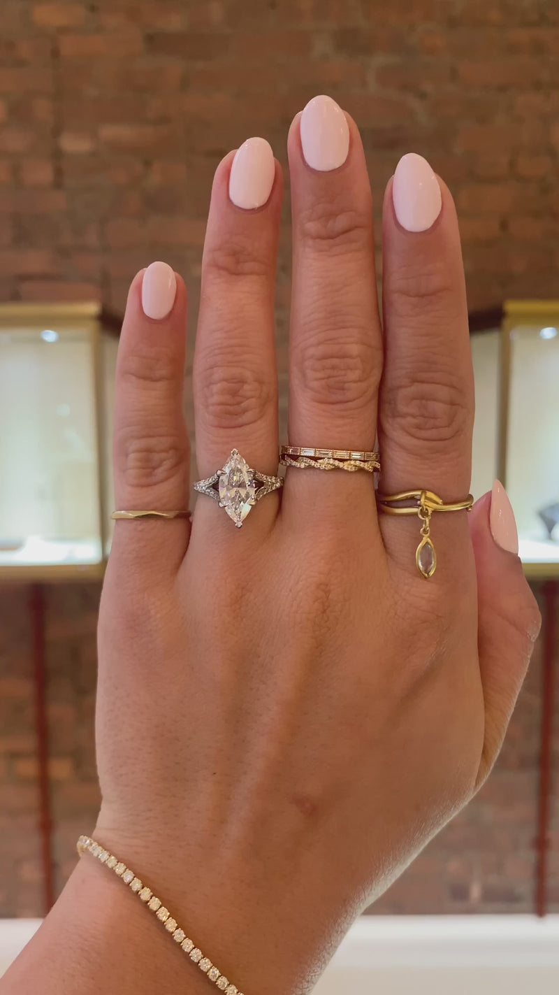 caption:Shown with 2ct marquise diamond in platinum