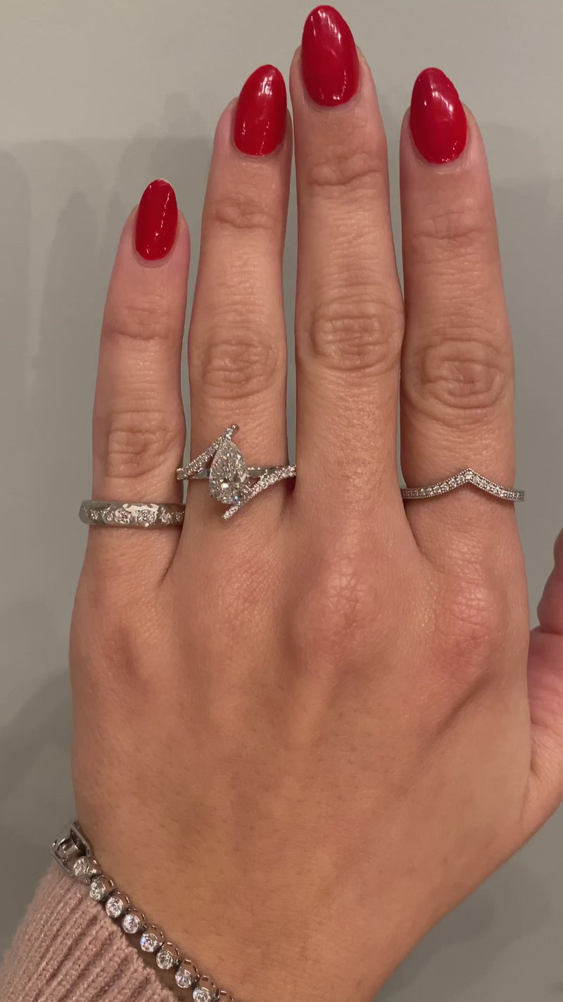 caption:Shown with 1.25ct pear diamond in platinum