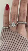 caption:Shown with 1.04ct pear diamond in platinum