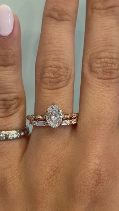 caption:Shown with 1.20ct oval diamond.  Styled with Leah wedding band.