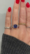 caption:Shown with cushion cut blue sapphire in platinum