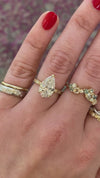 caption:Shown with 2.5ct pear diamond in yellow gold