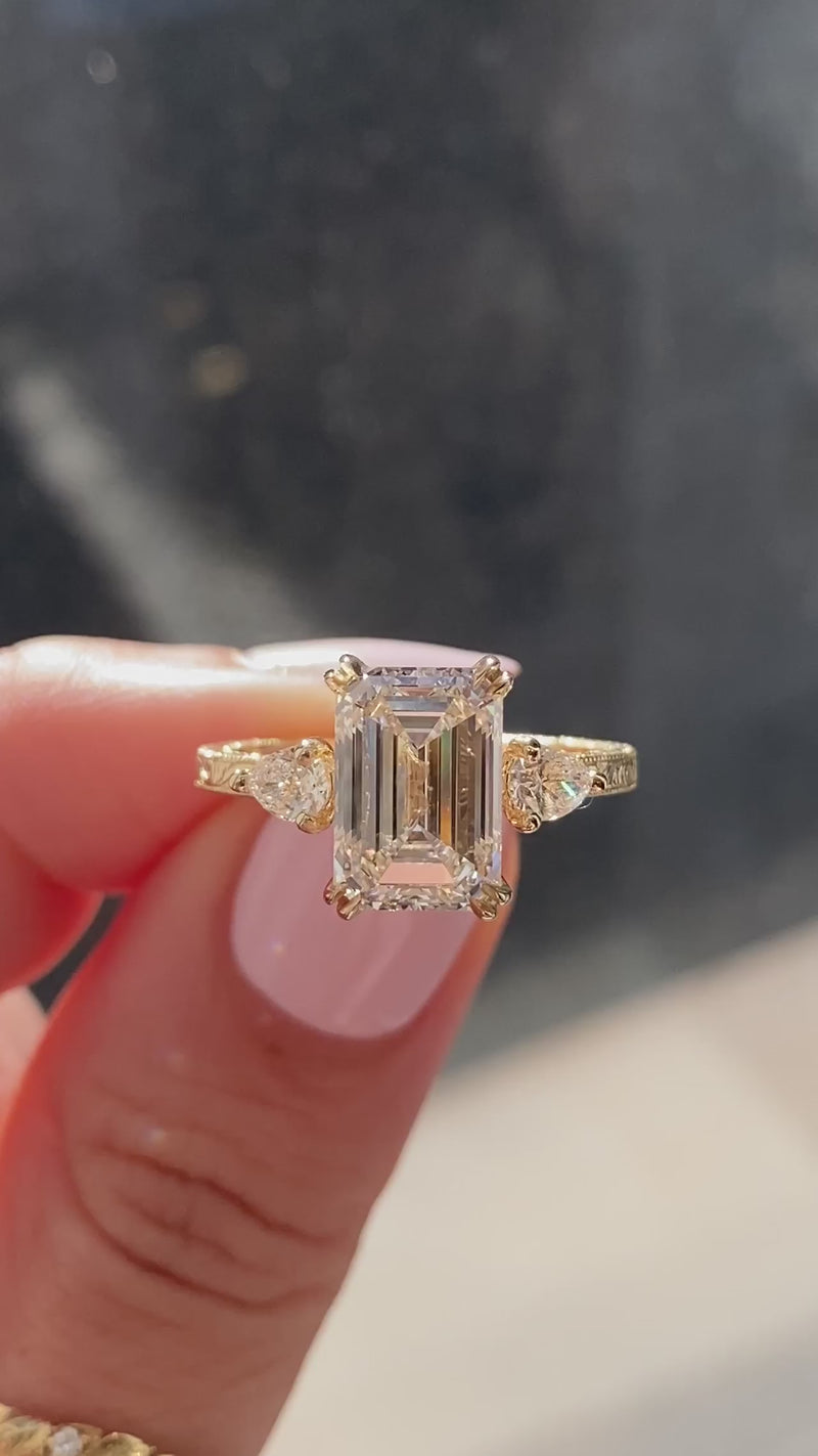 caption:Shown with 3ct emerald cut diamond in 14k yellow gold