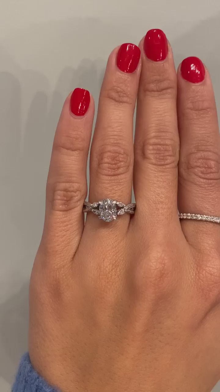 caption:Shown in platinum with 1.5ct oval diamond